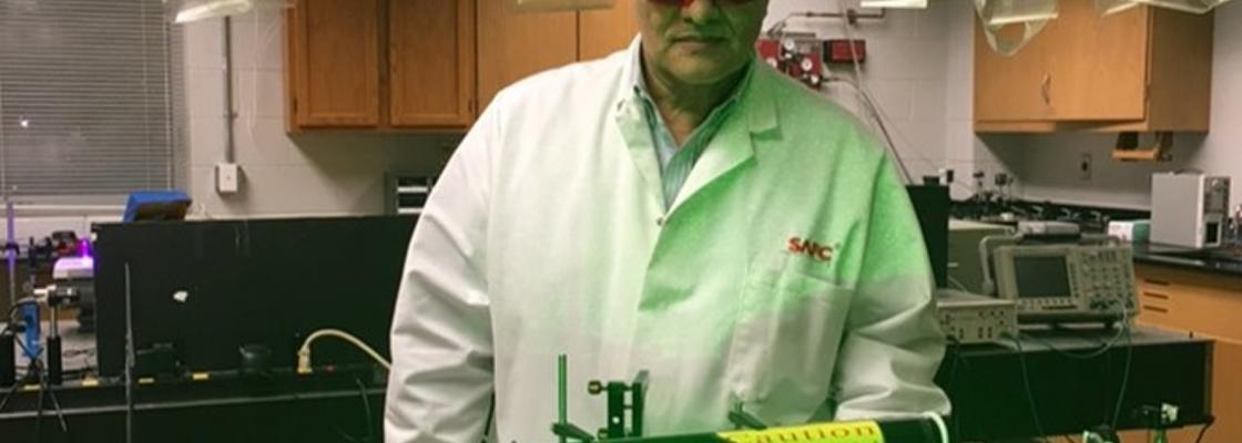Dr. Aristides Marcano working in the Laboratory of Quantum Optics at Delaware State University.
